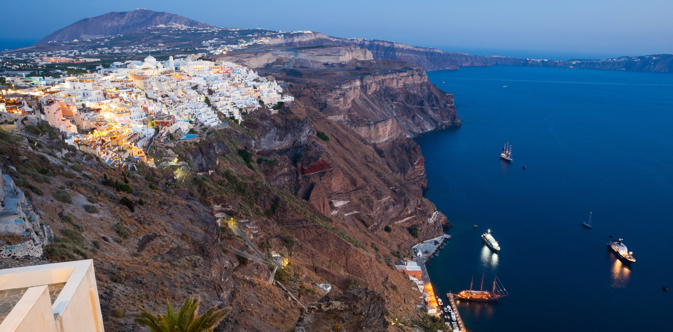 view of fira at sunset on santorini island, greece.